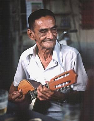 A Peruvian musician plays huayno music on his mandolin.